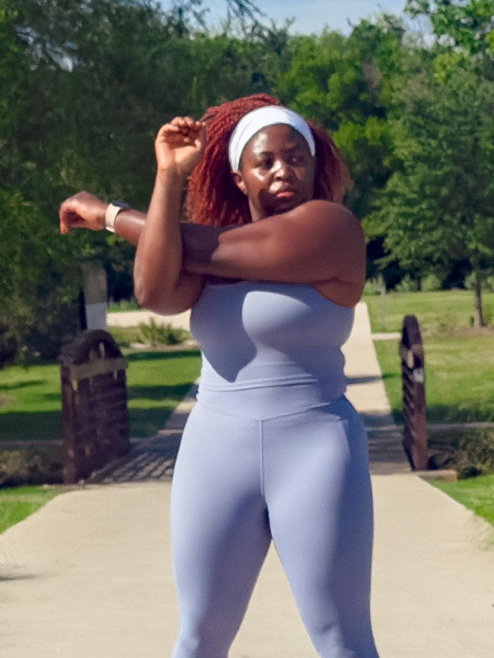 Woman stretching in blue set